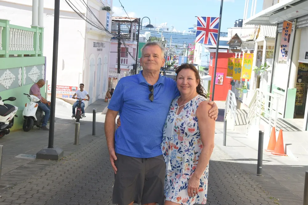 Guests in Puerto Plata’s old town, with a cruise ship docked at the end of the street